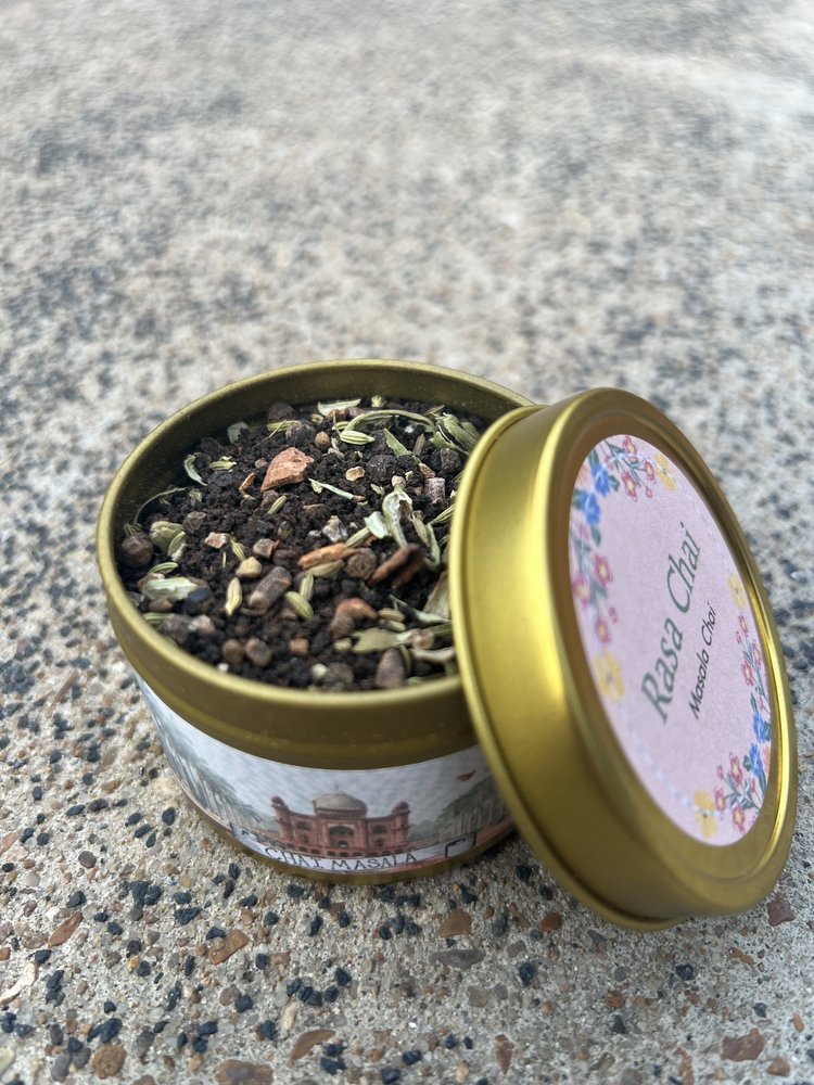 Open tin of masala chai showing the blend of spices